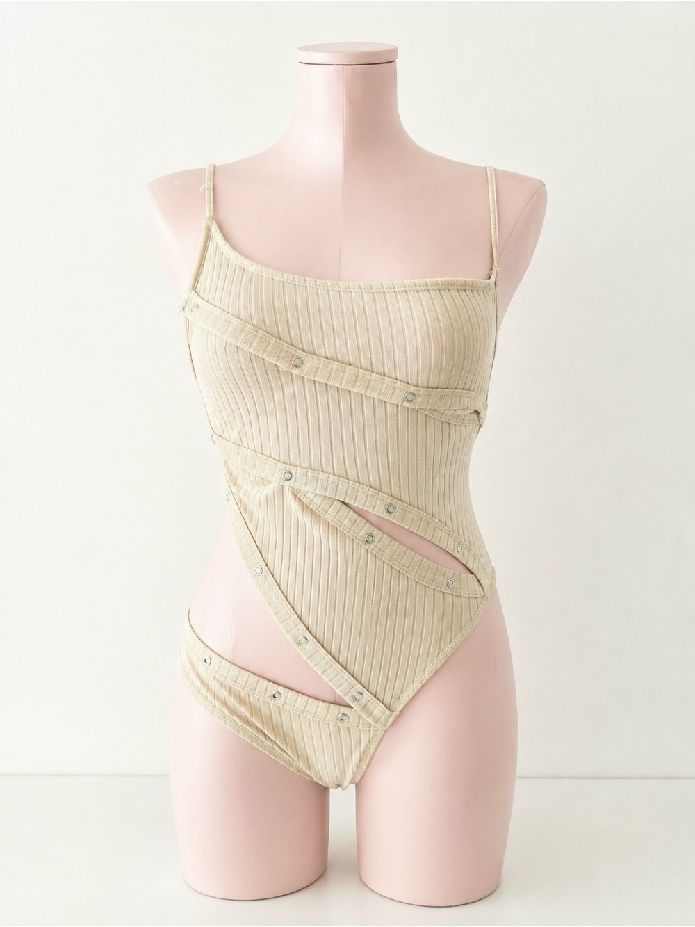 Ribbed Asymmetrical Snap-Detail Bodysuit in Cream Rave